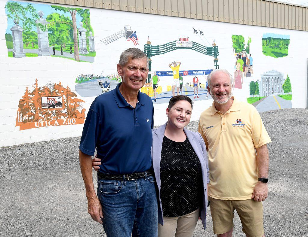 Artist Rachel Olsen in front of the Boilermaker mural.