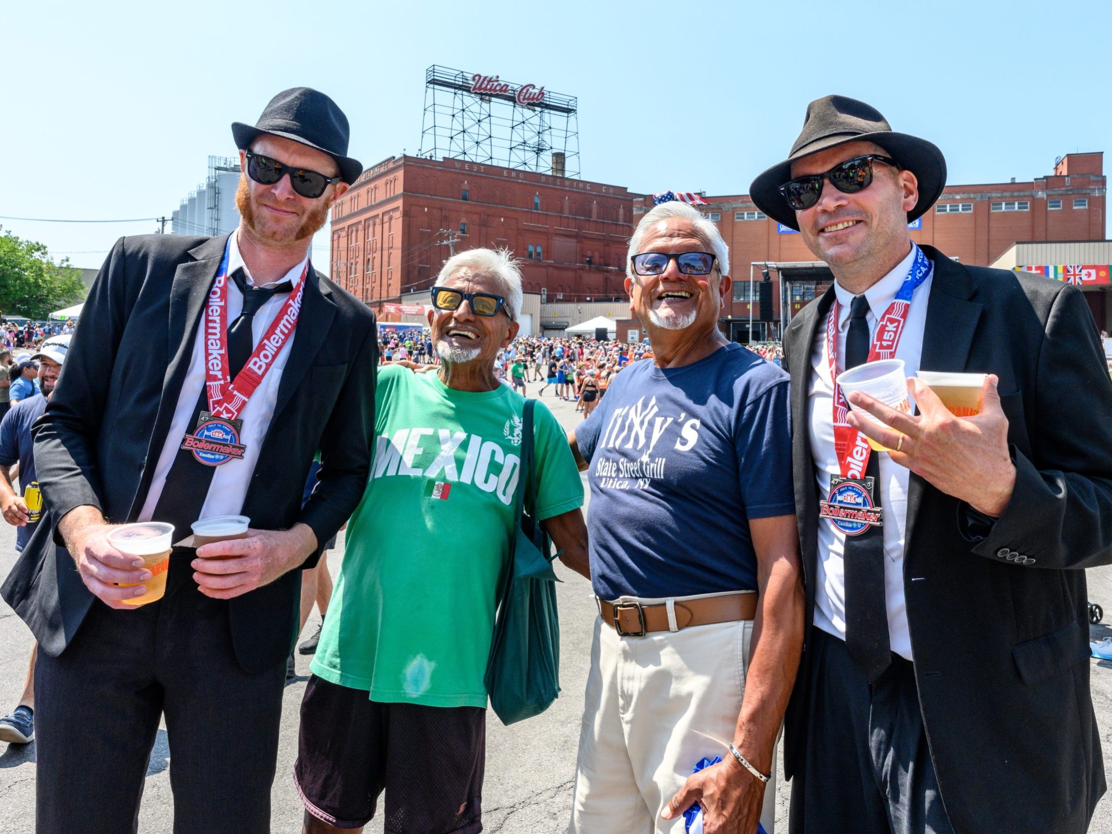 The Blue's Brothers pose with their medals and friends at the Boilermaker post race party
