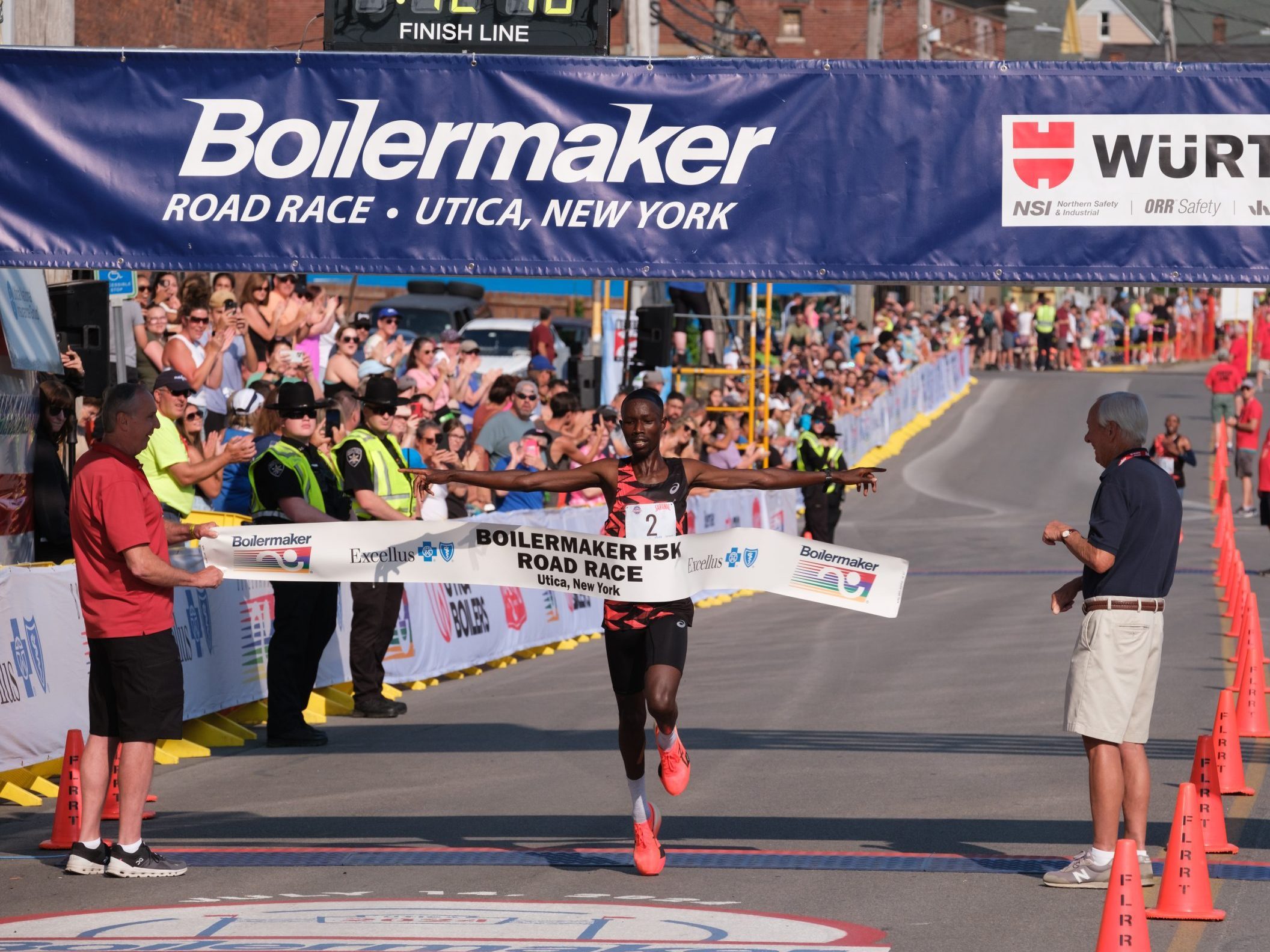 John Korir breaks the 15K finisher tape as he wins the 2024 Boilermaker