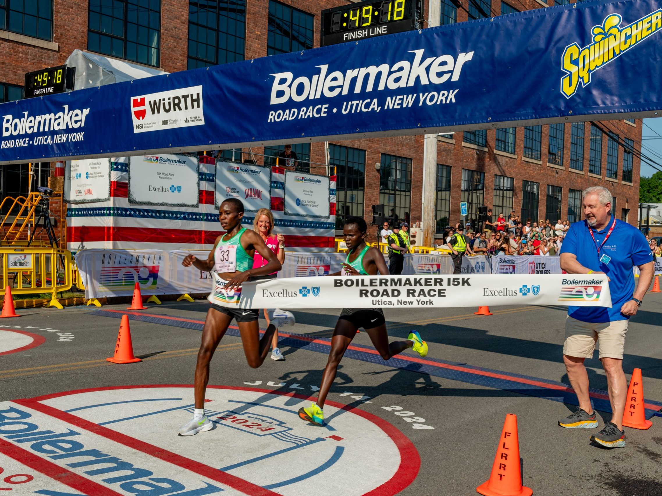 Grace Loibach Nawowuna wins the Female Open of the Boilermake 15K breaking the tape.