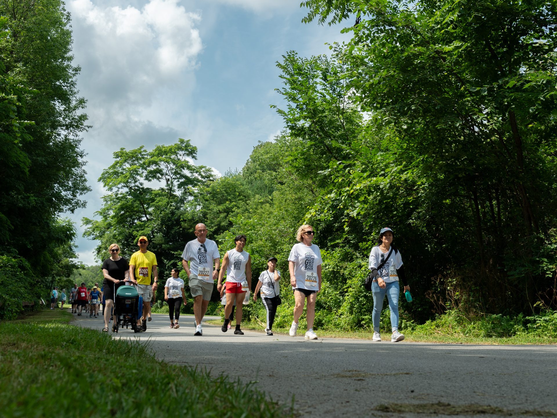 Participants of the 2024 Boilermaker Walk trek through the wooded part of the path