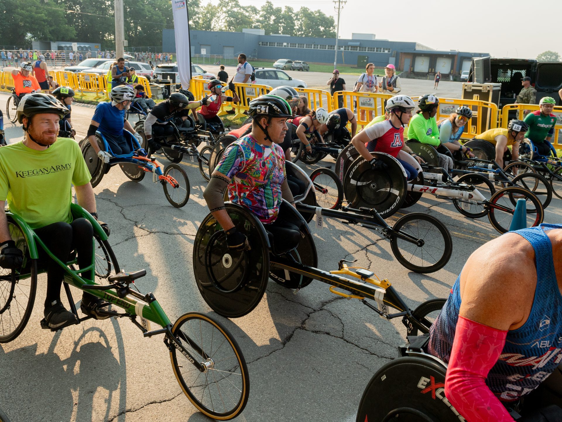 A group of wheelchair racers await the starting gun