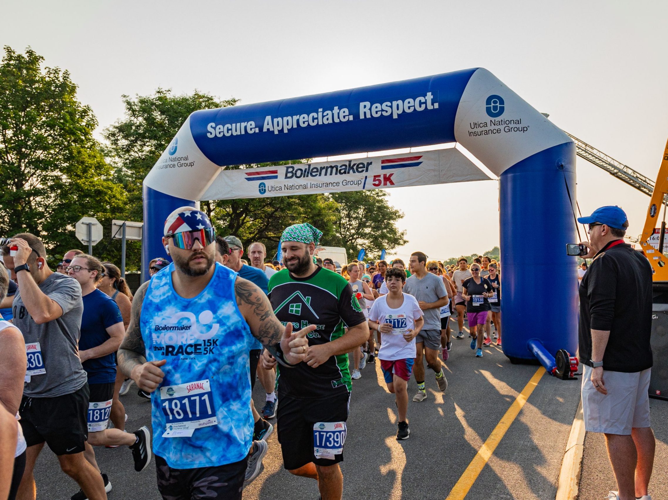Participants cross the start line of the 2024 Boilermaker 5K